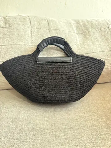 Black woven tote handbag with top handles - good condition