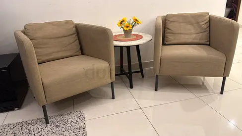Pair of beige fabric armchairs with metal legs - good condition