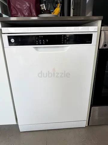 White freestanding Hoover dishwasher in full working condition