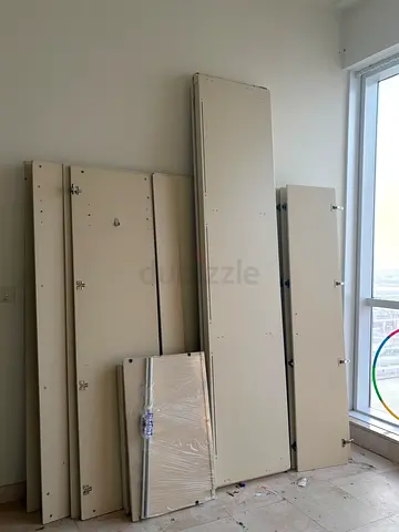 Flat-packed wardrobe panels and doors — ready for assembly