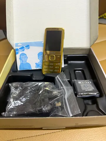 Nokia classic 6700 gold feature phone with charger and spare battery - good condition