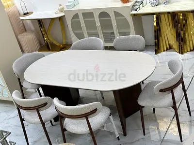 Modern oval dining table with 6 upholstered chairs - light wood finish