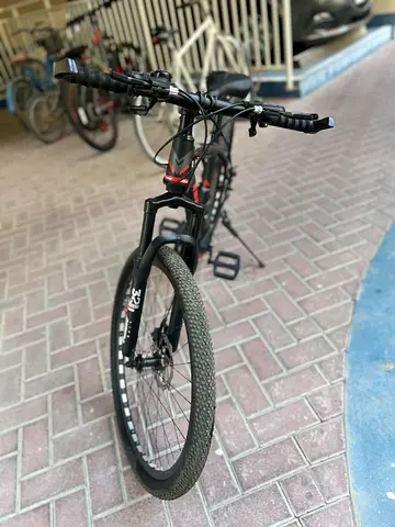 Used black mountain bike - good condition, front suspension, disc brakes