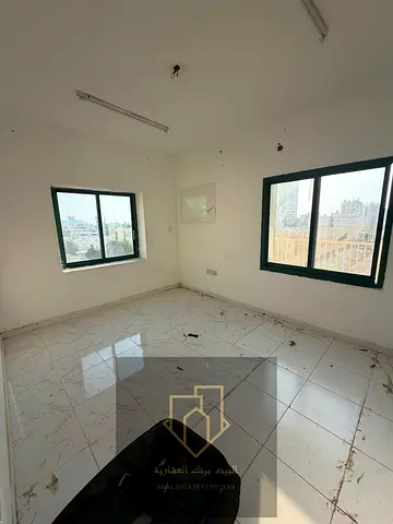 Two bedrooms and a living room for annual rent, second row from Ajman Corniche, for only 21,000 AED in 6 installments.