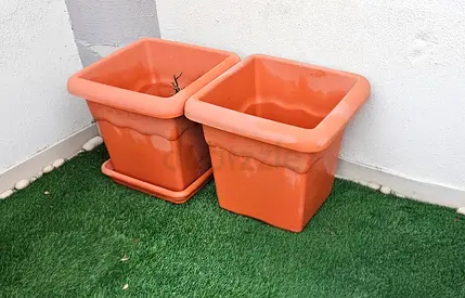2 plastic plant planters — good condition