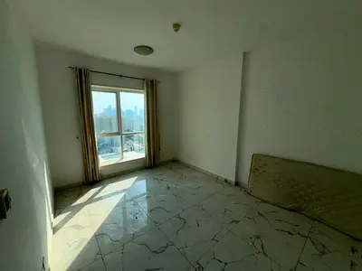 Annual Rent in Oasis Towers Tower 1 – Ajman Spacious two-bedroom apartment with a stunning sea view