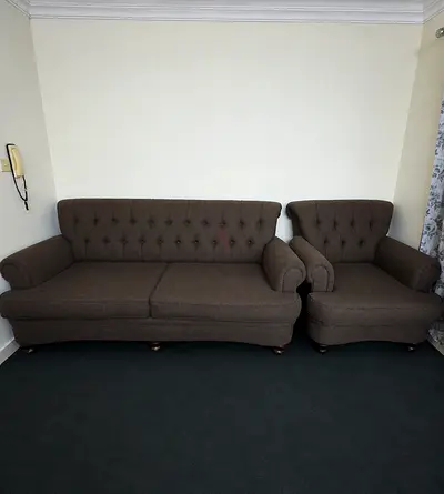 Brown tufted 3-seater sofa with matching armchair - good condition