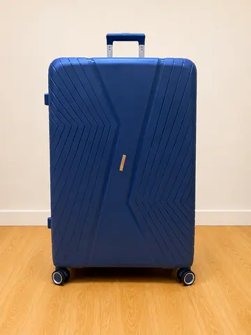 Large navy hard-shell wheeled suitcase with telescopic handle