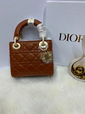 Christian Dior Lady Dior bag featuring iconic camel cannage quilted lambskin and pale gold