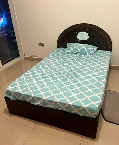 Single wooden bed with carved headboard + mattress and wooden box base - good condition