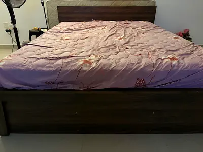 King size wooden bed frame with a very good mattress. Normal usage