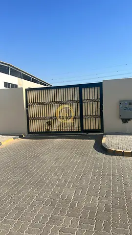 For rent: a plot in Industrial 18, with an area of 20,000 sq ft, located in a prime spot on a street with neighbors. Interlock flooring. Electricity a