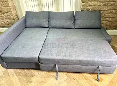 Grey fabric sofa bed with storage