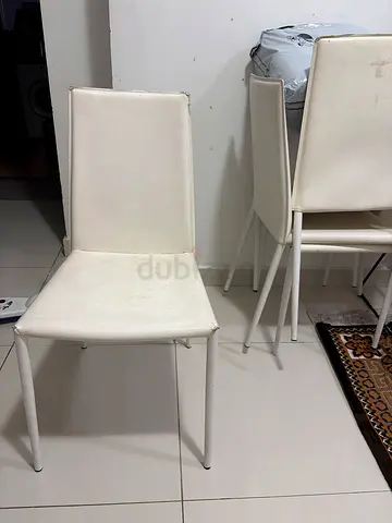 White Padded Dining Chairs( Calligaris) Original price- 1000AED