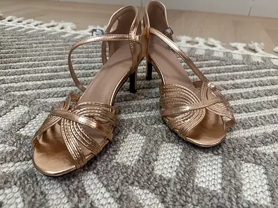 Gold strappy heeled sandals - size not specified, gently used