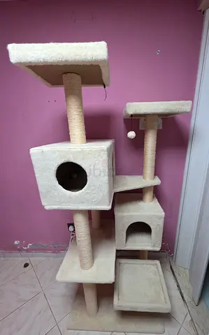 Beige multi-level cat tree with condo, perches and scratching posts