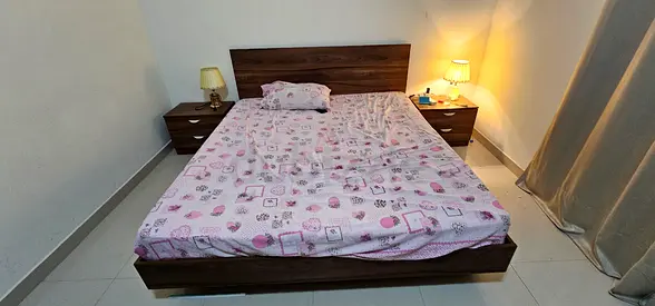 King wooden bed frame with two matching bedside two tables good condition with dresser with mirror