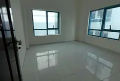 Annual rent in Al Khan. Spacious two bedroom apartment with living room, central AC and 2 bathrooms.