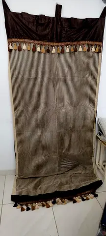 Brown striped curtain panel with tassel trim — single panel, good condition