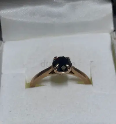 Rose gold solitaire ring with black diamonds and crystal diamond