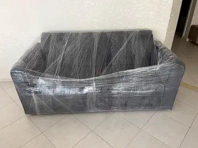 Brand new 3-seater gray sofa (wrapped for moving) - excellent condition