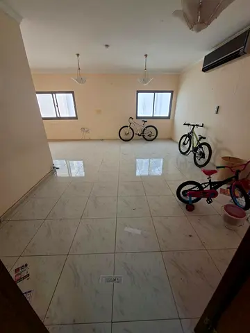Annual Rent in Al Majaz 3, Sharjah. Spacious 3-bedroom apartment with living room, 3 bathrooms, balcony, and split AC. Rent AED 45,000 yearly, AED 3,0