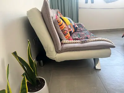 Modern convertible futon sofa bed in light grey - good condition