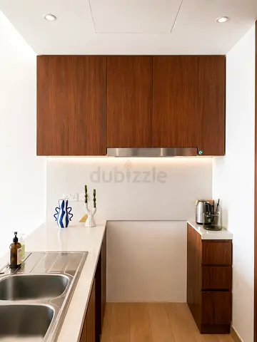 modern wooden style kitchen cabinets with white countertop