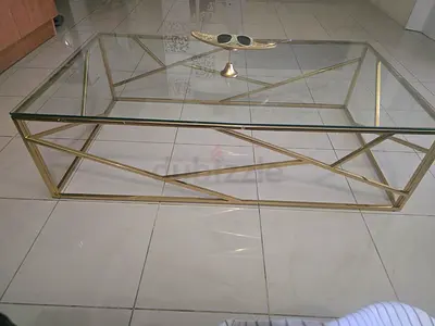 Glass Top Coffee Table with Gold Geometric Frame
