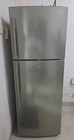 Silver double-door refrigerator - good working condition