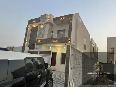 Villa for sale in Al Yasmeen, Ajman, featuring 4 master bedrooms, two living rooms, a kitchen, and a maid's room; includes electricity, water, and air
