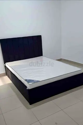 Queen-size upholstered bed frame with headboard - dark navy
