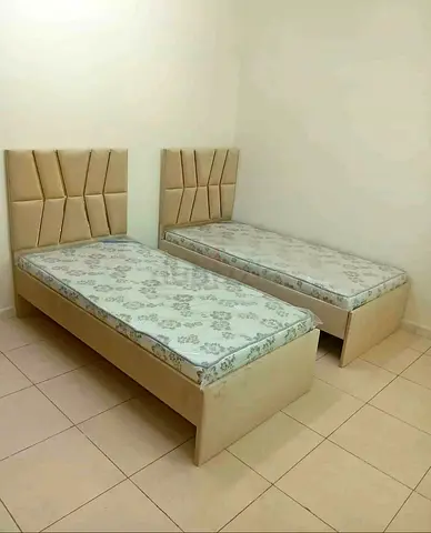 Pair of single beds with mattresses - beige upholstered headboards