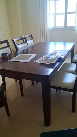 Solid Wood 6-Seater Dining Table with Cushioned Chairs - Good Condition