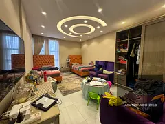 A stunning villa for annual rent in the Al Yasmeen area, Ajman. It features high-end hotel-style fin