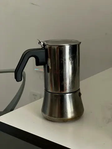 Used stainless steel stovetop moka coffee maker (espresso pot)