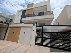 Villa for sale in Al-Yasmeen featuring 5 master bedrooms, a majlis, a living area, a kitchen, and a
