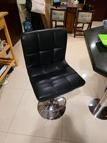 Two Black Adjustable Bar Stools with Padded Seat and Chrome Base