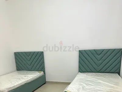 Pair of single beds with upholstered chevron headboards - light green السعر قابل للتفاوض