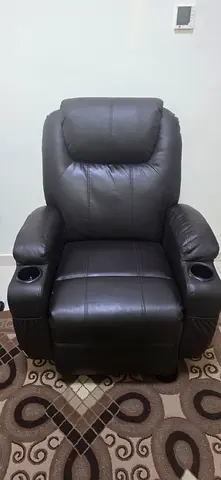 Dark brown leather power recliner chair with cup holder and massager
