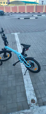 Light blue kids 16-inch bicycle with stabilizers - good condition.