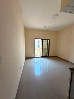 For rent in Al Bu Tina, Sharjah: Spacious studio with balcony and central AC in a prime location. AE