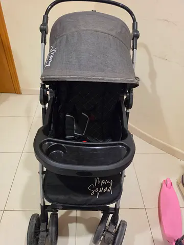 Lightweight grey baby stroller with sun canopy and tray (used)