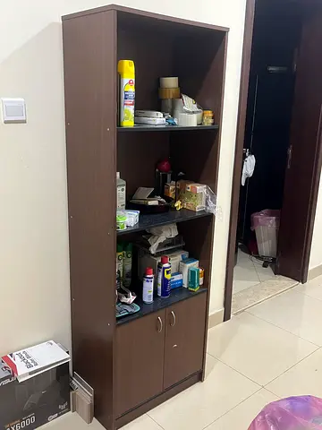 Tall dark-brown storage cabinet with shelves and closed cupboard
