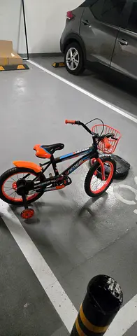 Childs 12-inch training bike with stabilizers - good condition
