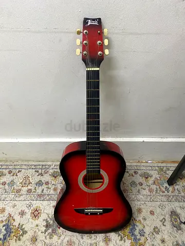 Used red beginner acoustic guitar - good for practice