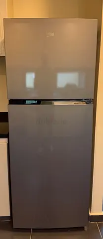 Grey two-door refrigerator - good condition