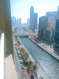 Two bedrooms and a living room for rent in Al Qasba with a stunning sea view, private parking, spaci