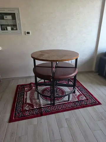 Small round wooden bar table with two stools - good condition
