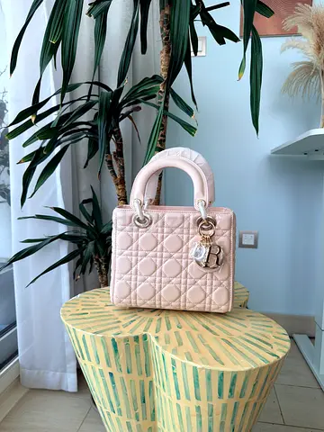Light pink quilted structured handbag with top handles